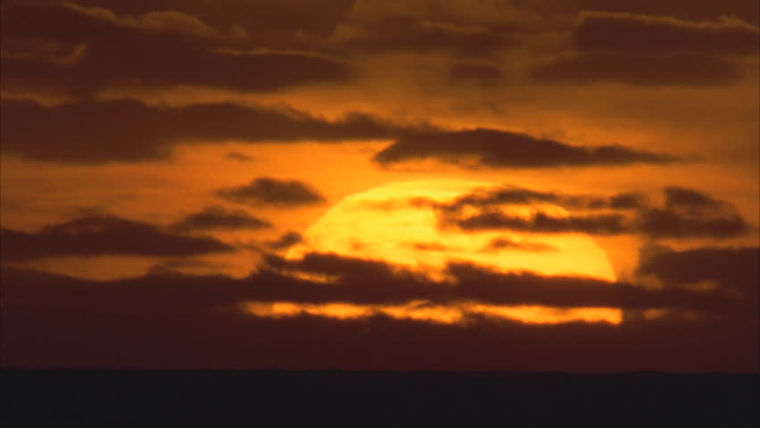 Sunset over water. One fifth water four fifths sky | Shutterstock HD Video #5873801