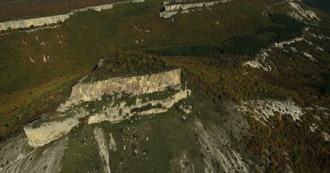 Aerial View: Chufut-Kale fortress. Mountain plateau of Burunchak. Chufut-Kale is a national monument of Crimean Karaite culture and Tatar fortress in Crimea, near Bakhchisaray. Crimea. Autumn 2013.