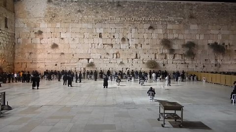 JERUSALEM, ISRAEL - DECEMBER 6: Orthodox Jewish men pray at the Western Wall on December 6, 2013, Jerusalem, Israel. The Wall is the holiest place for Jewish people. 
