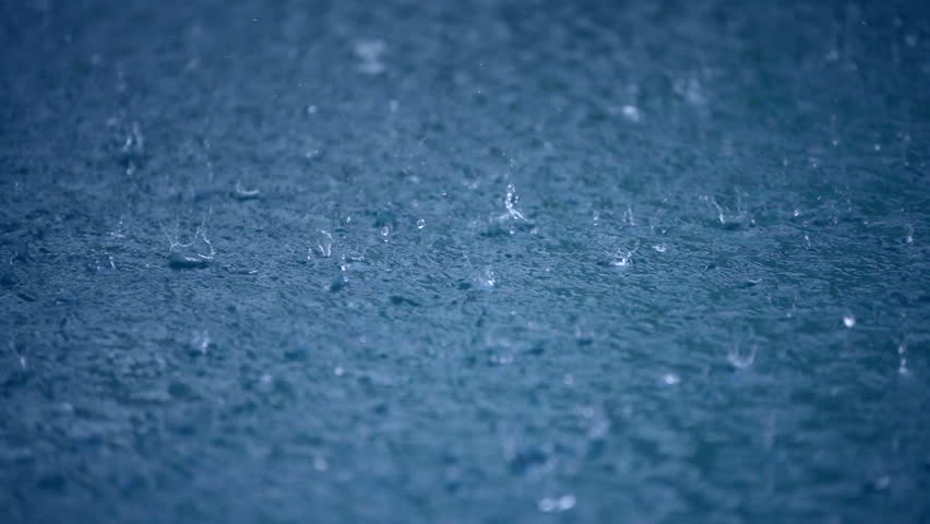 Raining water blue background, drops to puddle surface, wet weather, abstract liquid nature closeup video. Raindrop falling season. Splash, ripple on the road in rainy city, dark heavy storm outdoors. Royalty-Free Stock Footage #5880830