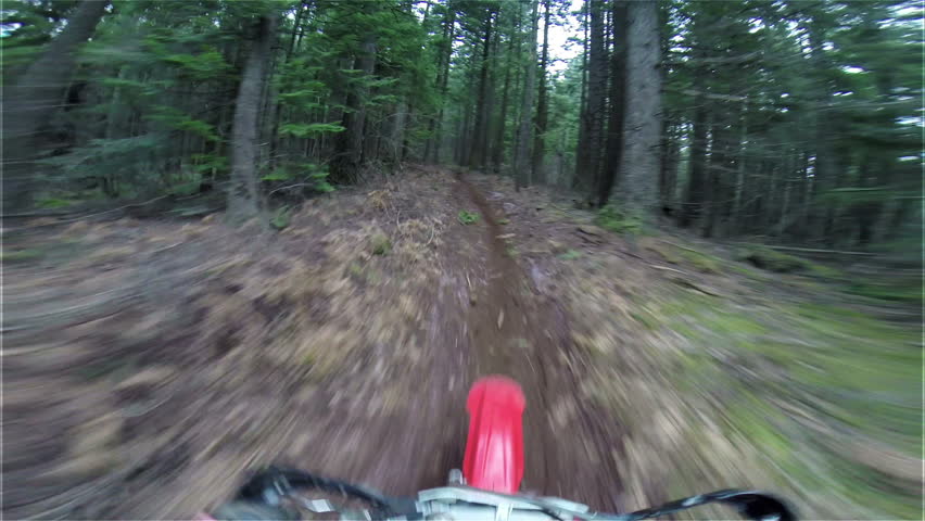 Extreme Head Mounted Camera on Fast Motocross Rider Blazing through a Green Forest Trail on a Red Motorcycle Dirt Bike 1080 HD Video with Sound in Oregon Backcountry on Nice Dirt Trail with Greenery  Royalty-Free Stock Footage #5882162