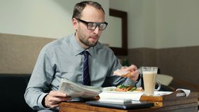 Businessman reading magazine during breakfast in hotel room
 - Powered by Shutterstock - Get 15% off with code: PIKWIZARD15