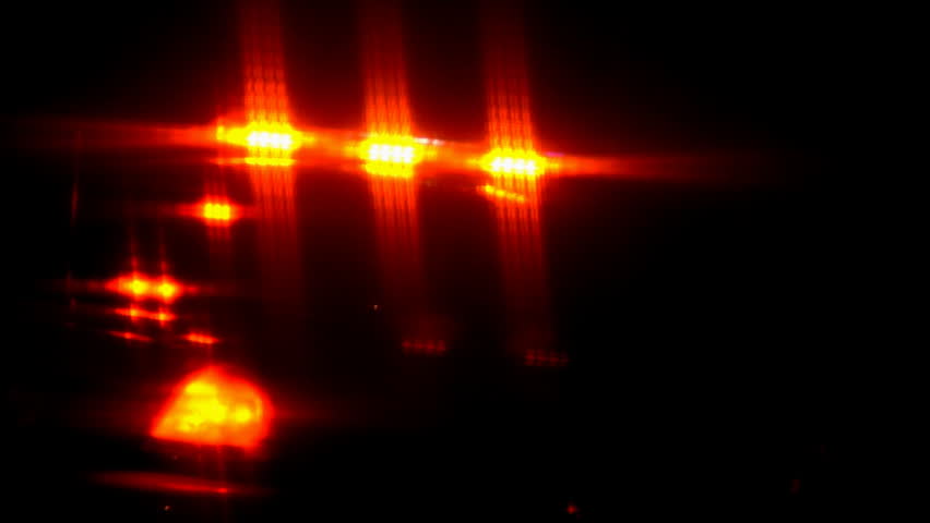 Out-of-focus flashing police car lights.