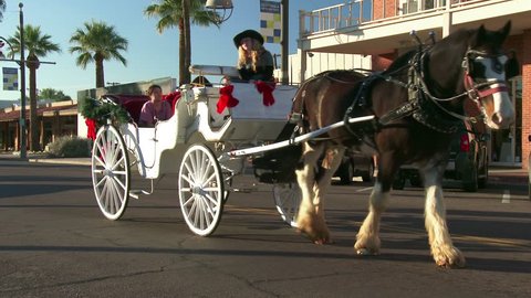 SCOTTSDALE, ARIZONA – DECEMBER 23: Horse drawn carriage in Old Town Scottsdale, Arizona on December 23, 2013.