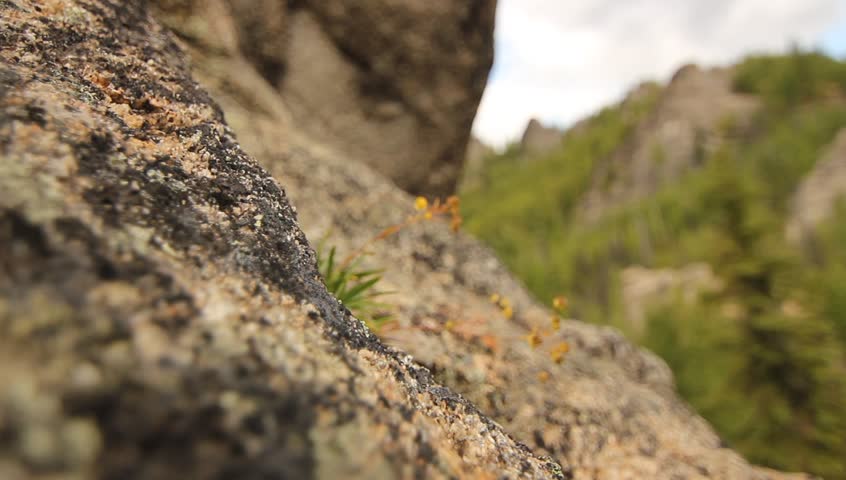 Mountains Cliffs Angels Rocks Alaska. Rock cliffs and mountains in the lush forests of Angel Rocks, Alaska. Features pockets carved into the rocks, trees, and greenery.