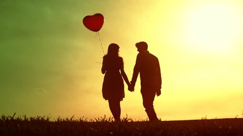 Young Couple Planning Future Hugging Sunset Silhouette Vídeo Stock