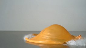Water balloon breaking in super slow motion. Shot with Phantom camera at 6900 frames per second. - Powered by Shutterstock - Get 15% off with code: PIKWIZARD15