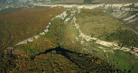 Aerial View: Chufut-Kale fortress. Mountain plateau of Burunchak, near Bakhchisaray, Crimea. Chufut-Kale is a national monument of Crimean Karaite culture and Tatar fortress in Crimea. Autumn 2013