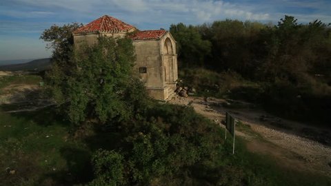 Aerial View: Chufut-Kale fortress, Mausoleum of Dzhanike-Khanym. Crimea. Chufut-Kale is a national monument of Crimean Karaite culture and Tatar fortress in Crimea. Autumn 2013
