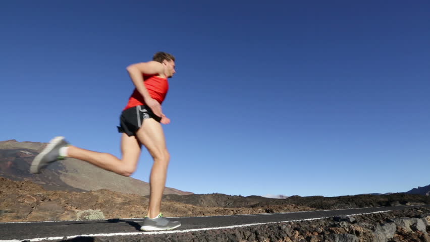 Running athlete man. Male runner jogging outdoors ...