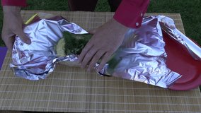 preparing fresh zucchini for cooking in foil
