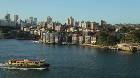 SYDNEY, AUSTRALIA - FEBRUARY 03, 2014: Sydney ferry sails to North Sydney harbour suburbs. Sydney Ferries can trace its roots as far back as the arrival of the first fleet in 1789.
