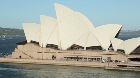 SYDNEY, AUSTRALIA - FEBRUARY 03, 2014: Tilt upwards to sky, Sydney Opera House, The Opera House opened in October 1973 and was designed by Jorn Utzon.
