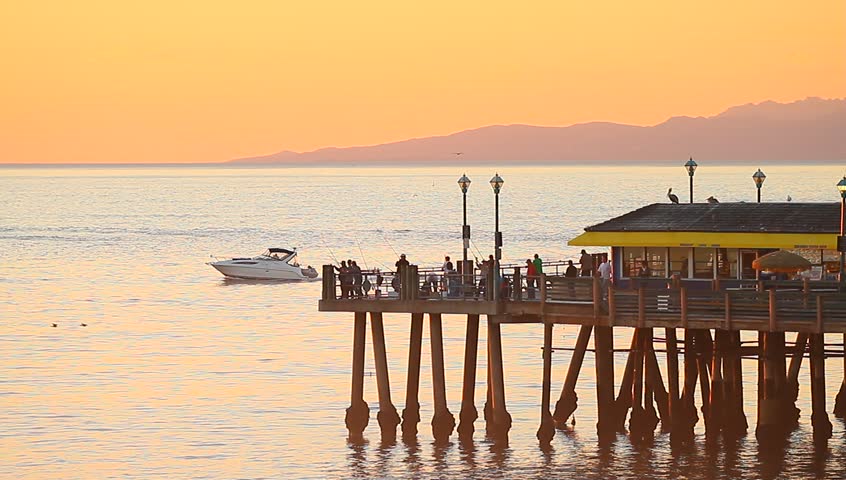 People Pier. People are walking along on the pier.