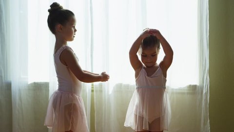 Young girls practicing ballet at home - 4k