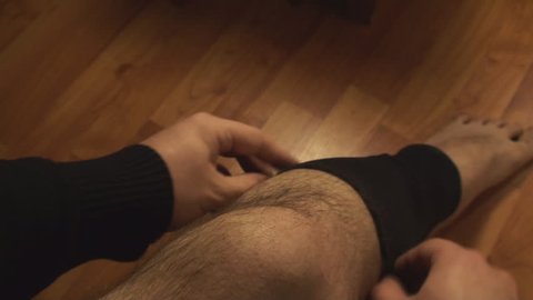 Man Putting Knee Brace, Injury, Knee Pain, Healing, Point Of View-Shot