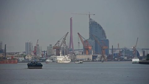 ships pass by shanghai huangpu river pier,number Of tower cranes On construction site,moder urban building.  gh2_06836