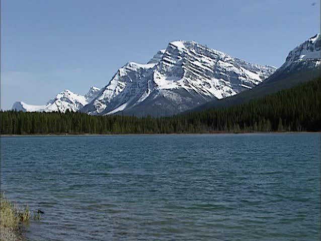 BANFF NATIONAL PARK pan mountain lake and scenery, Rampart Creek, Icefields Parkway. Officially designated by UNESCO as World Heritage Site.