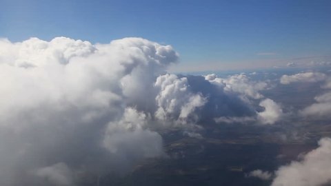 flying through clouds , Traveling by air. View through an airplane window, background texture for jet side window (1920x1080, hidef. HD, high definition 1080p) 