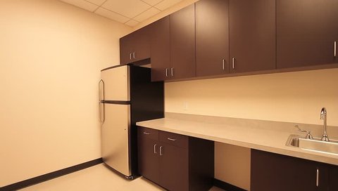 Office Kitchenette Stock Footage, Office Break Room Cabinets With Sink