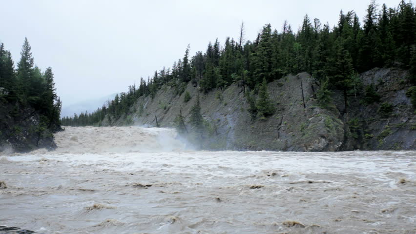 fast flowing river carrying flood water Stock Footage Video (100% ...