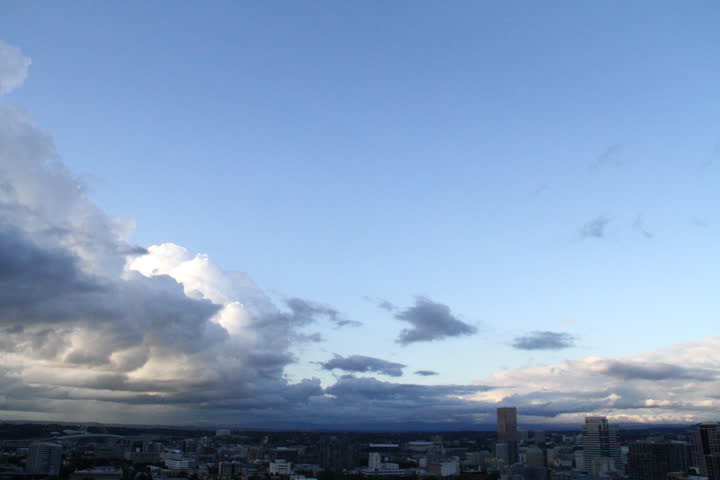 Storm Clouds City. Storm clouds float over city buildings.