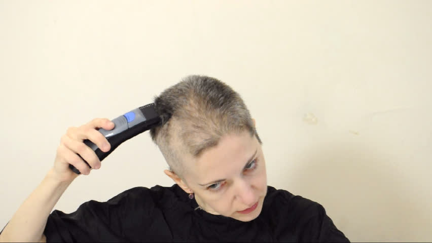 woman shaves bald