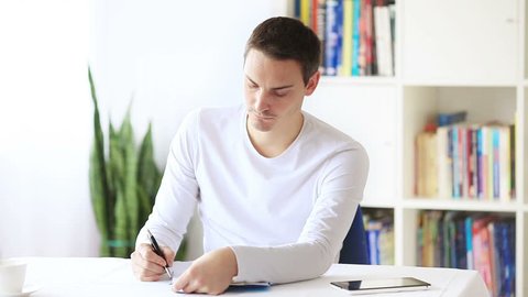 Man write some document at home office