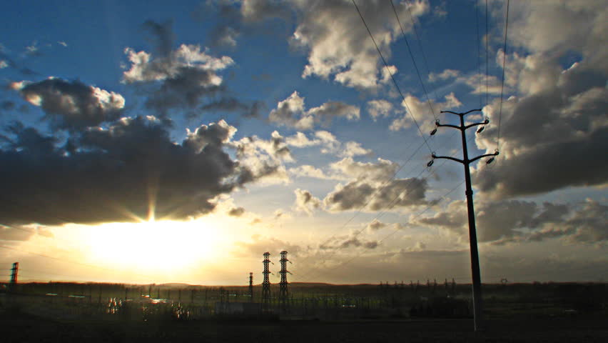 Sun and clouds over power station, HD time lapse clip
