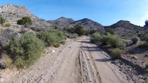 Off-road driving up steep and rough high-desert mountain trails.  POV filmed in the mountains between St. George, UT and Mesquite, NV.