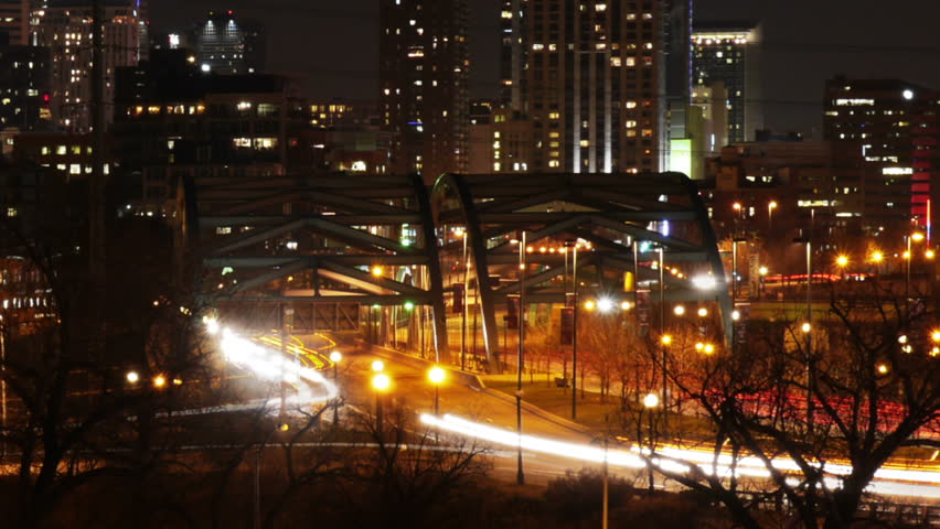 Downtown Denver traffic on bridge at night. Long exposure time-lapse. HD 1080p.