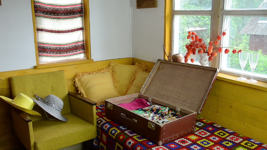 Girl woman prepare summer clothes for holidays. Colorful rural room.