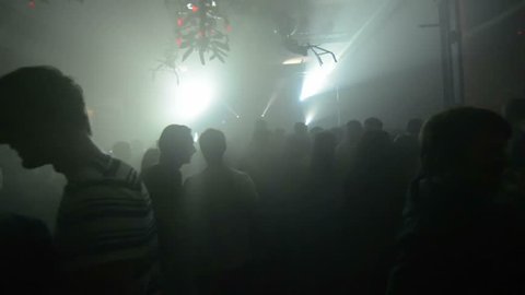 dance party. walking through live show. amazing pov shot passing through a silhouetted crowd. 