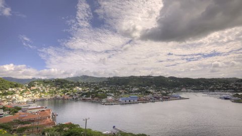 HDR Time lapse St Georges Bay in Grenada with clouds passing by
