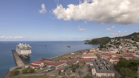 SAINT GEORGE, GRENADA - DEC 2012: Time lapse Panorama of Saint George's harbor on Grenada Island with cruise ship by the jetty on December 16, 2012 in St George, Grenada