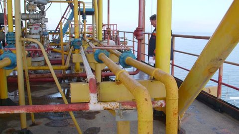 Sea of Azov, Crimea - March 28, 2014: Engineer working on offshore gas and oil production platform in the East-Kazantip field