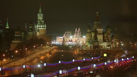 Traffic near Kremlin and St. Basil cathedral at dark winter night
