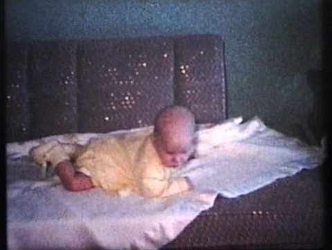 Mother Dressing Baby For Winter (1963 - Vintage 8mm film)