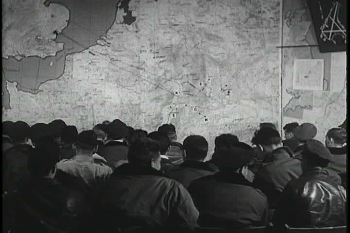 CIRCA 1940s - World War Two pilots receive a briefing about an upcoming mission.