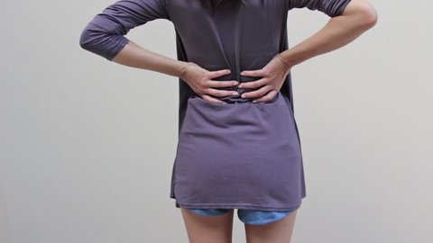 woman with backpain, spinal, waist, lower back problem, rear view body closeup