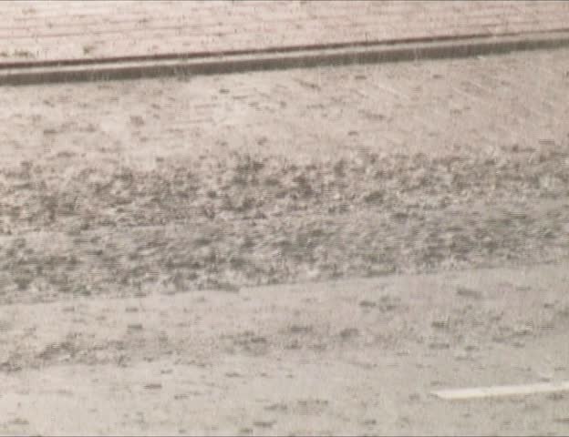 street with heavy rain and cars
