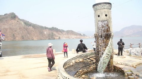 NAMI ISLAND - MARCH 21: Statue stone waterfall and people walking on March 21,
2014 in South Korea