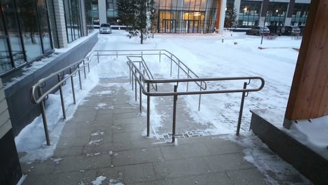 Exit from business center and courtyard at winter snowy day