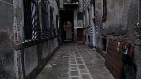 Dark alley of the rainy streets in Venice, Italy 