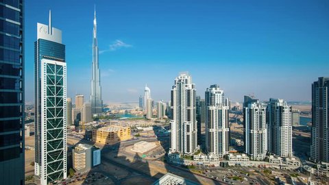 DUBAI, UAE - MARCH 28, 2014: Panoramic view of Burj Khalifa tower from day to night,  the tallest man-made structure in the world, at 829.8 m (2,722 ft). Time lapse movie.
