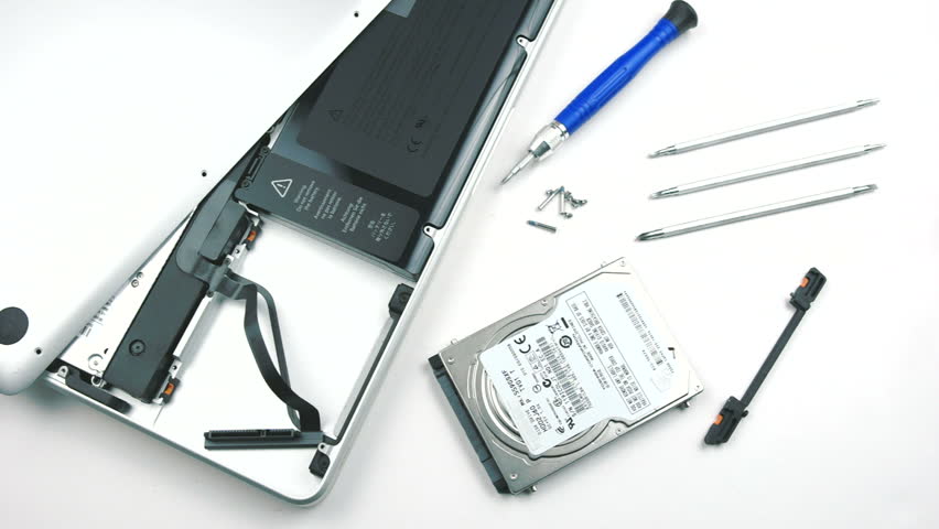 Laptop Hard Drive Replacement - Technician replaces a hard drive in a laptop.