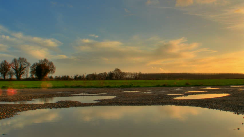 Cloud reflections in ponds, HD motion time lapse clip, high dynamic range