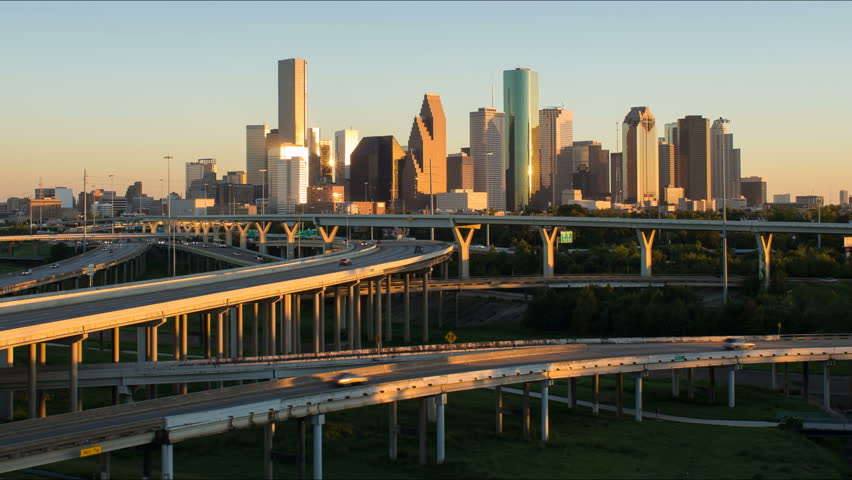 HOUSTON - CIRCA NOVEMBER 2013: Houston, Texas, USA, highway, city skyline, dusk to night