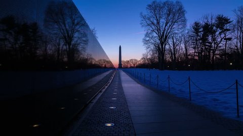 Washington D.C. - Time-lapse of sunrise reflecting in Vietnam Memorial Wall with Washington Monument in the background