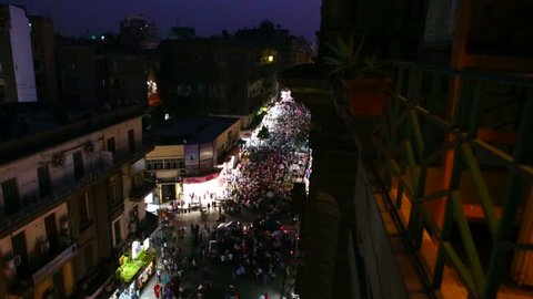 Overhead view of a large nighttime protest rally in the stets of Cairo, Egypt.